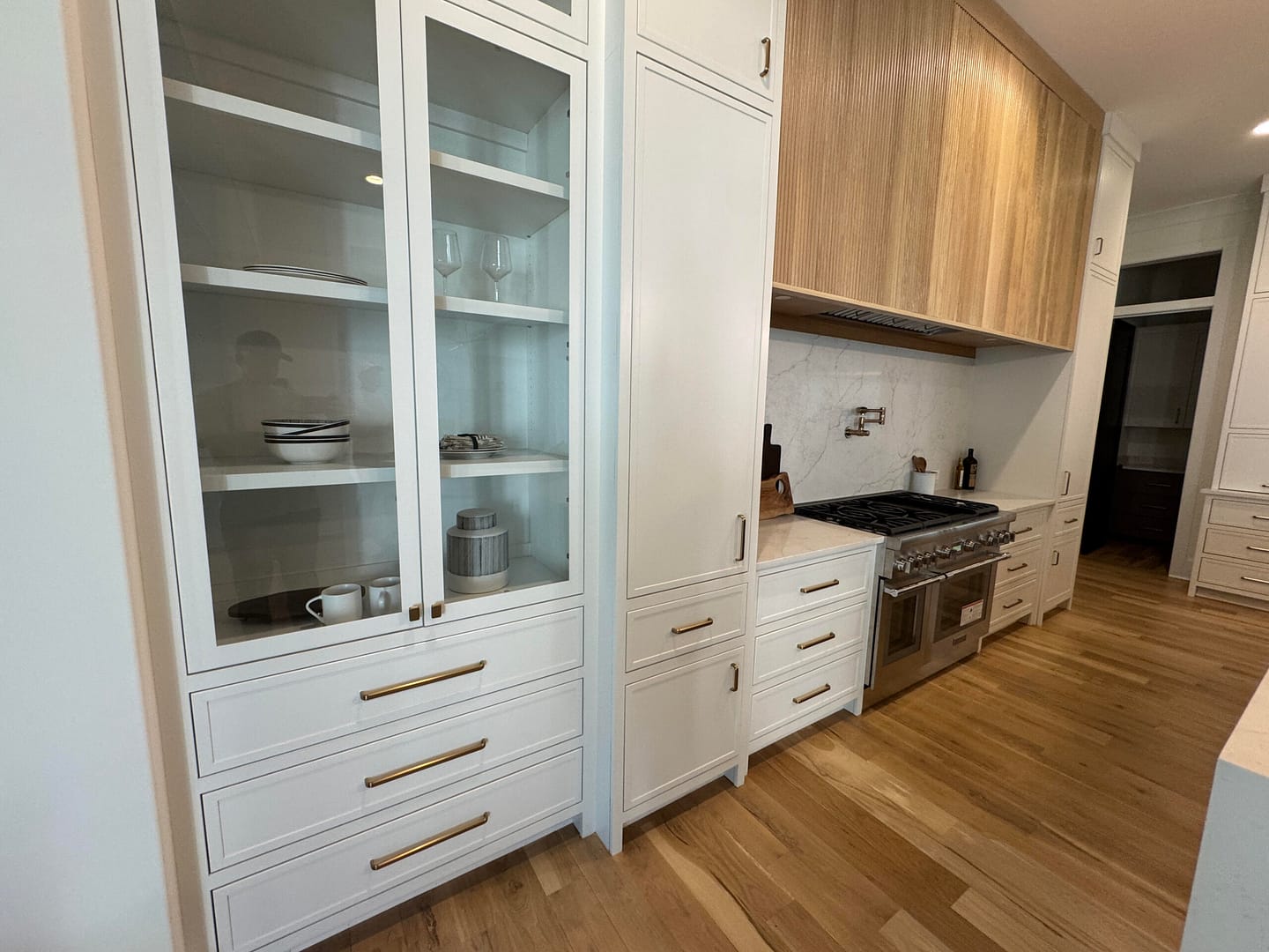 Shelf Solutions custom pull-out shelves in a Brentwood kitchen
